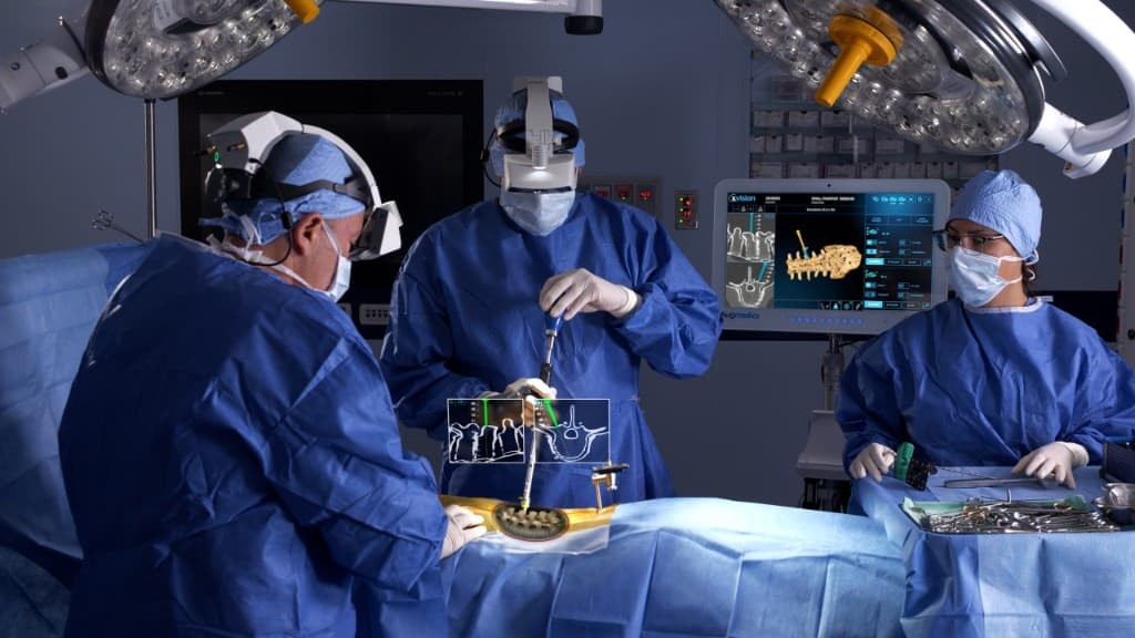Neurosurgeons performing advanced spine surgery with augmented reality navigation in the operating room